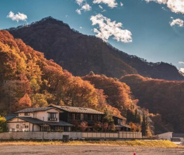 Autumn mountains and traditional ryokan buildings at Yamakikan in Gunma Kanto