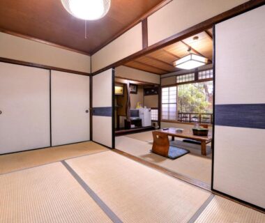 Tatami room with low table and shoji screens at Yamamoto Ryokan in Kyoto, Kansai