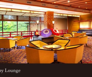 Lobby lounge with yellow armchairs and large windows at Yamanaka Onsen Kissho Yamanaka, Ishikawa, Chūbu, Japan