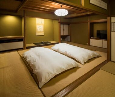 Futon bedding on tatami with shoji screens at Yamanoo, Ishikawa, Chūbu, Japan