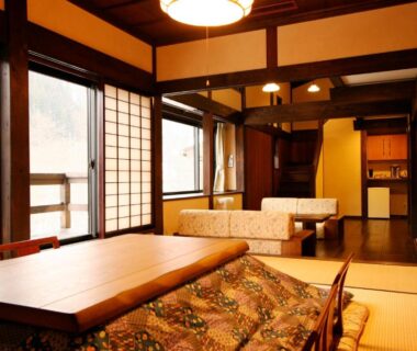 Traditional tatami room with low table, kotatsu and shoji screens in Yamazatonoiori Soene, Gifu