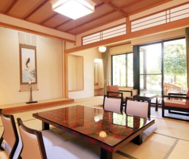 Tatami room with low lacquer table, shoji screens and garden view, Yanagiya ryokan, Yamanashi