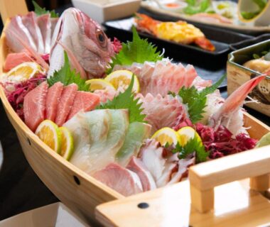 Assorted sashimi in wooden boat at Yasuraginoyado Yufu, Ōita, Kyūshū