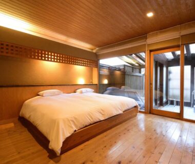 Low bed, sliding doors and outdoor wooden bath at Yatsusankan, Chūbu Gifu Japan