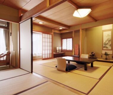 Traditional tatami room with shoji screens, low table and zabuton at Yokikan in Shizuoka