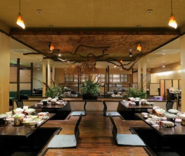 Low wooden dining tables with floor cushions at Yorokobinoyado Takamatsu, Gunma, Kantō