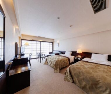 Spacious twin room with desk and shoji-style windows at Yorozuya, Nagano, Chūbu, Japan