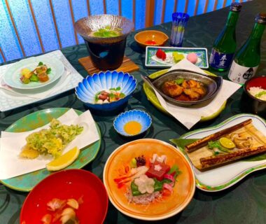 Assortment of sashimi, grilled fish, tempura and side dishes with sake at Yoshidaya Ryokan, Nara