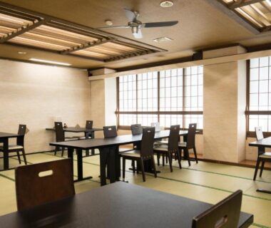Tatami dining area with low tables and chairs at Yoshino ryokan in Shizuoka, Chūbu, Japan