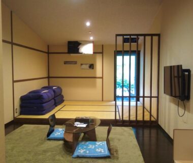 Tatami seating area with low table and cushions at YuYu Hakone, Kanagawa, Japan