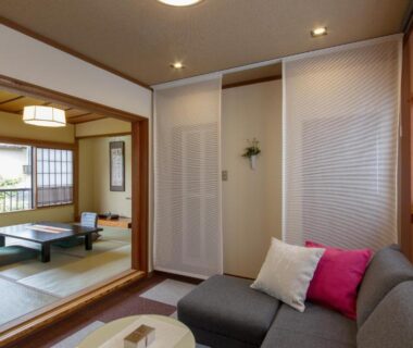 Tatami seating area with sofa and shoji screens at Yuasobiyado Akebono, Niigata, Chūbu