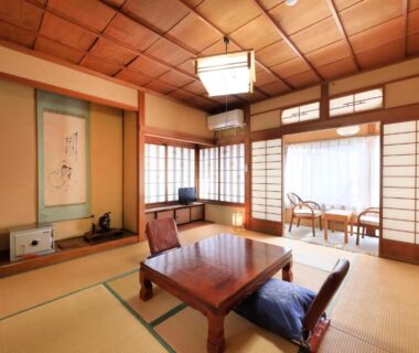 Tatami room with low table, shoji screens and tokonoma at Yudanaka Seifuso, Nagano