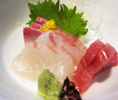 Assorted sashimi slices on ceramic plate at Yudanaka Tawaraya Ryokan in Nagano, Chūbu, Japan