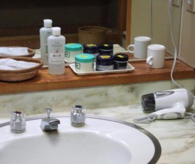 Sink with hairdryer and toiletries at Yudanaka Yumoto, Nagano