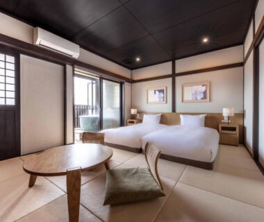 Tatami room with twin beds, low table and shoji screens at Yufudake Ichibo no Yado Kirara, Ōita, Kyūshū