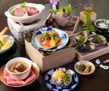 Assorted Japanese multi-course meal with tempura, small bowls and hot pot at Yufuin Besso Shikisai Hotel, Ōita