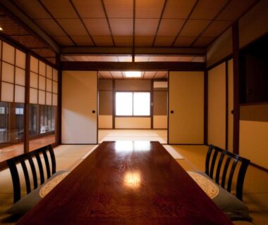 Tatami dining room with low table and shoji screens at Yufuin Gettouan in Ōita, Kyūshū