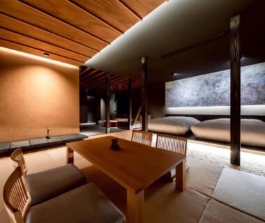 Low tatami seating and wooden table in a modern guest room at Yufuin Kaze no Mori, Ōita, Kyūshū