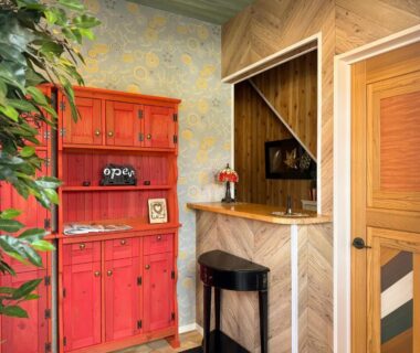 Red cabinet beside wooden entry counter and stool at Yufuin Onsen 8A1 Yaeichi, Ōita