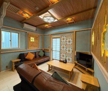 Low table and brown sofas with shoji screens in Yufuin Onsen 8A1 Yaeichi, Ōita