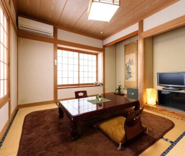 Tatami room with low table and shoji screens at Yufuin Onsen Oyado Jinnouchi, Ōita