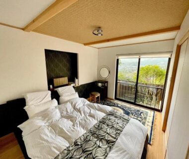 Bright bedroom with twin beds and balcony, Yufuin-Sanso Waremokou, Ōita, Kyushu