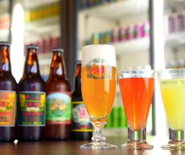 Glasses and bottled craft beer on bar counter at Yufuin Sansuikan, Ōita, Kyūshū, Japan