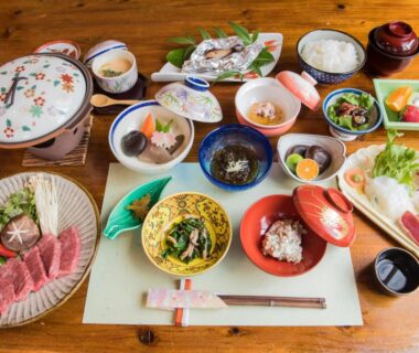 Assorted small Japanese dishes with rice and soup at Yufunoyado Kifu in Ōita, Kyūshū