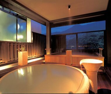 Round wooden soaking tub and stools at Yugawara Ohnoya Ryokan in Kanagawa, Kantō