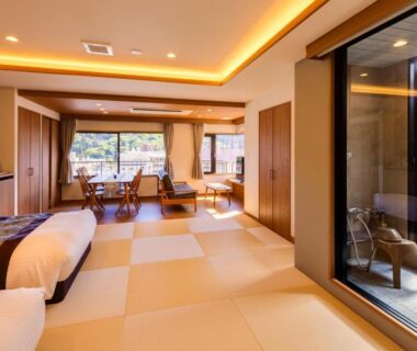 Spacious tatami room with twin beds, seating area and wooden terrace bath at Yugawara-Onsen Hotel Shiroyama Kanagawa