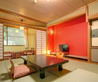 Tatami room with low table, zabuton cushions and shoji screens at Yugawara-Onsen Komachikan Kanagawa