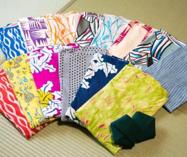 Assorted colorful yukata and tabi on tatami at Yugawara-Onsen Komachikan, Kanagawa