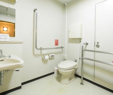 Accessible bathroom with handrails, sink and toilet at Yugawara Onsen Mizuno-kaori, Kanagawa