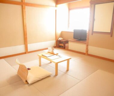Bright tatami room with low table and floor cushion at Yugawara Retreat Goen no Mori in Kanagawa, Kantō