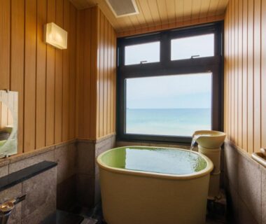 Indoor onsen bath with sea view at Yuhigauraonsen ShizukaHanaogi in Kyoto, Kansai