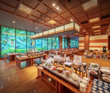 Spacious dining buffet with wooden ceiling and garden view at Yukaen, Iwate
