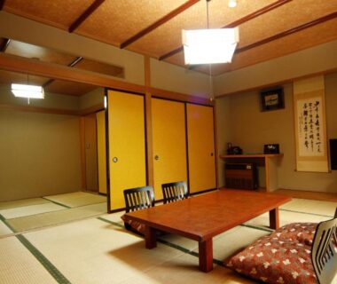 Traditional tatami room with low table and zabuton cushions, sliding fusuma doors at Yumoto Choseikan, Kantō