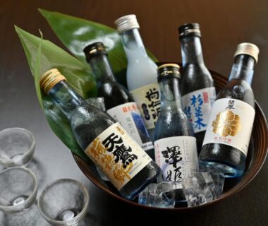 Chilled sake bottles in an ice bowl with two small cups at Yumoto Itaya in Tochigi