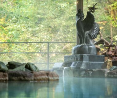 Onsen with stone fountain and forest view at Yumoto Kissho Miyagi Tōhoku