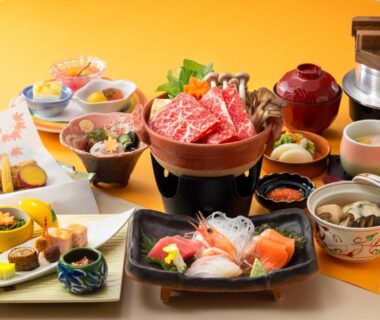 Assorted sashimi, marbled beef and side dishes arranged on a table at Yumoto Noboribetsu, Hokkaidō