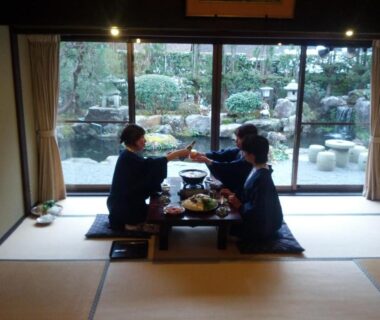 Guests in yukata dining on tatami with garden pond view at Yumoto Onsen OharaSansou Kyoto
