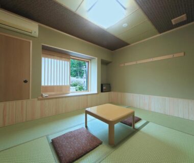 Tatami room with low table and cushions at Yumoto Onsen OharaSansou, Kyoto