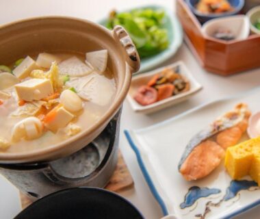 Clay pot nabe with tofu, grilled fish, tamagoyaki and small dishes at Yumotoya in Nagano, Chūbu