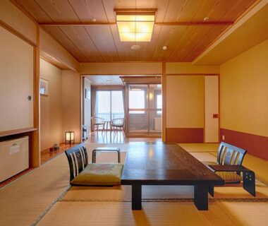 Tatami room with low table and floor chairs at Yunohama Hotel, Hokkaidō Japan