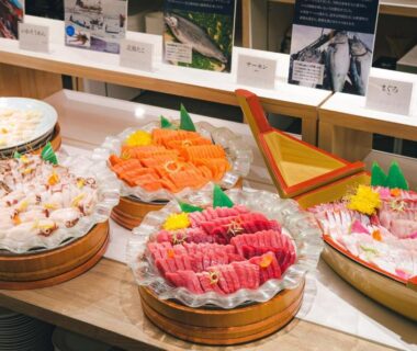 Assorted sashimi platters on wooden trays at Yunohama Hotel buffet, Hokkaidō