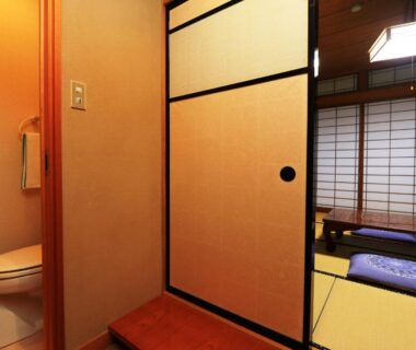 Tatami room with shoji screens, sliding fusuma and low table at Yunohirakan in Gifu