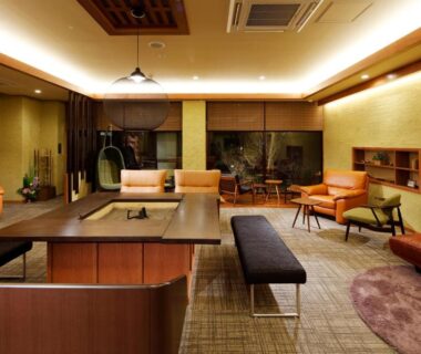 Modern lounge with low table and sofas at Yunokawa Onsen Emi Hakodateya, Hokkaidō Japan