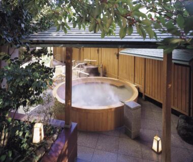 Steaming round wooden onsen tub at Yunokuni Tensyo in Ishikawa, Chubu, Japan