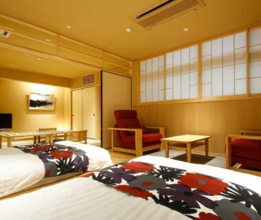 Twin tatami room with shoji screens and seating at Yuraku Kinosaki Spa & Gardens, Hyōgo