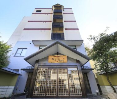 Multi-story building with traditional entrance gate at Yururi Nishiizu, Shizuoka, Chūbu